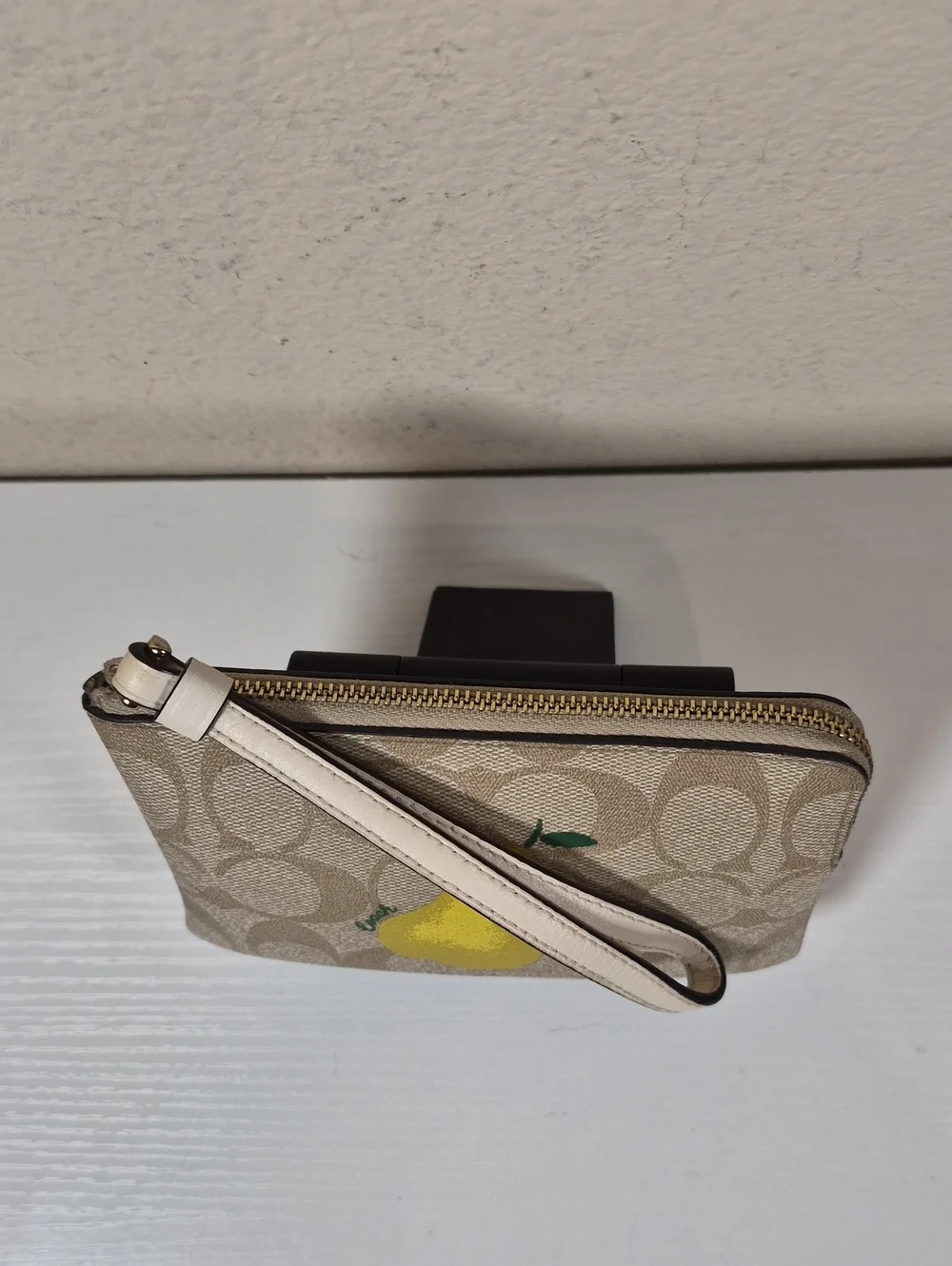 Coach Corner Zip Wristlet In Signature Canvas With Pear